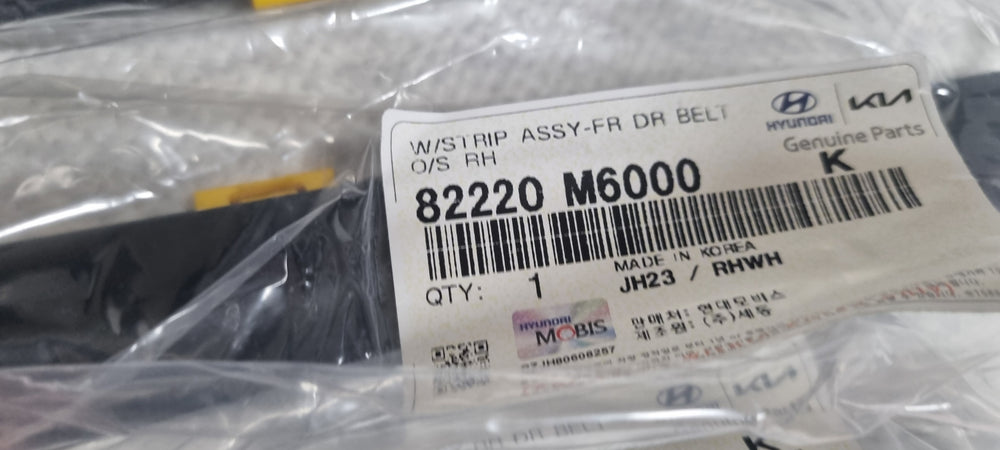 82220M6000-W/STRIP ASSY-FR DR BELT O/S RH